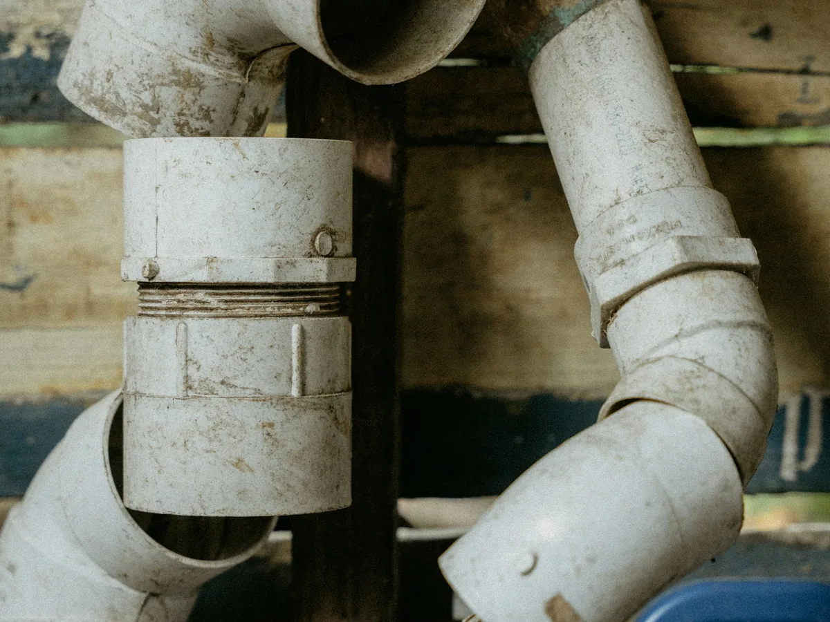 Close view of drain piping that illustrates careful plumbing diagnostics